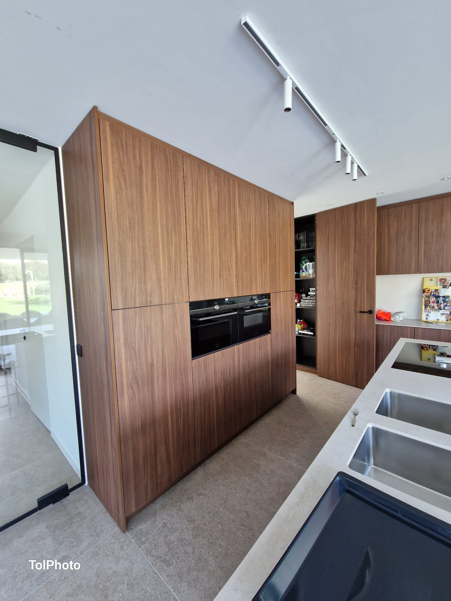 Walnut kitchen with appliances